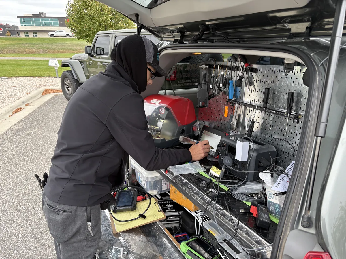 Mobile locksmith workstation open at a customer site